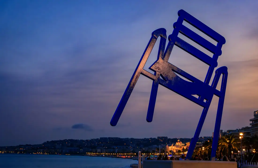 The giant blue chair on the Promenade des Anglais at dusk