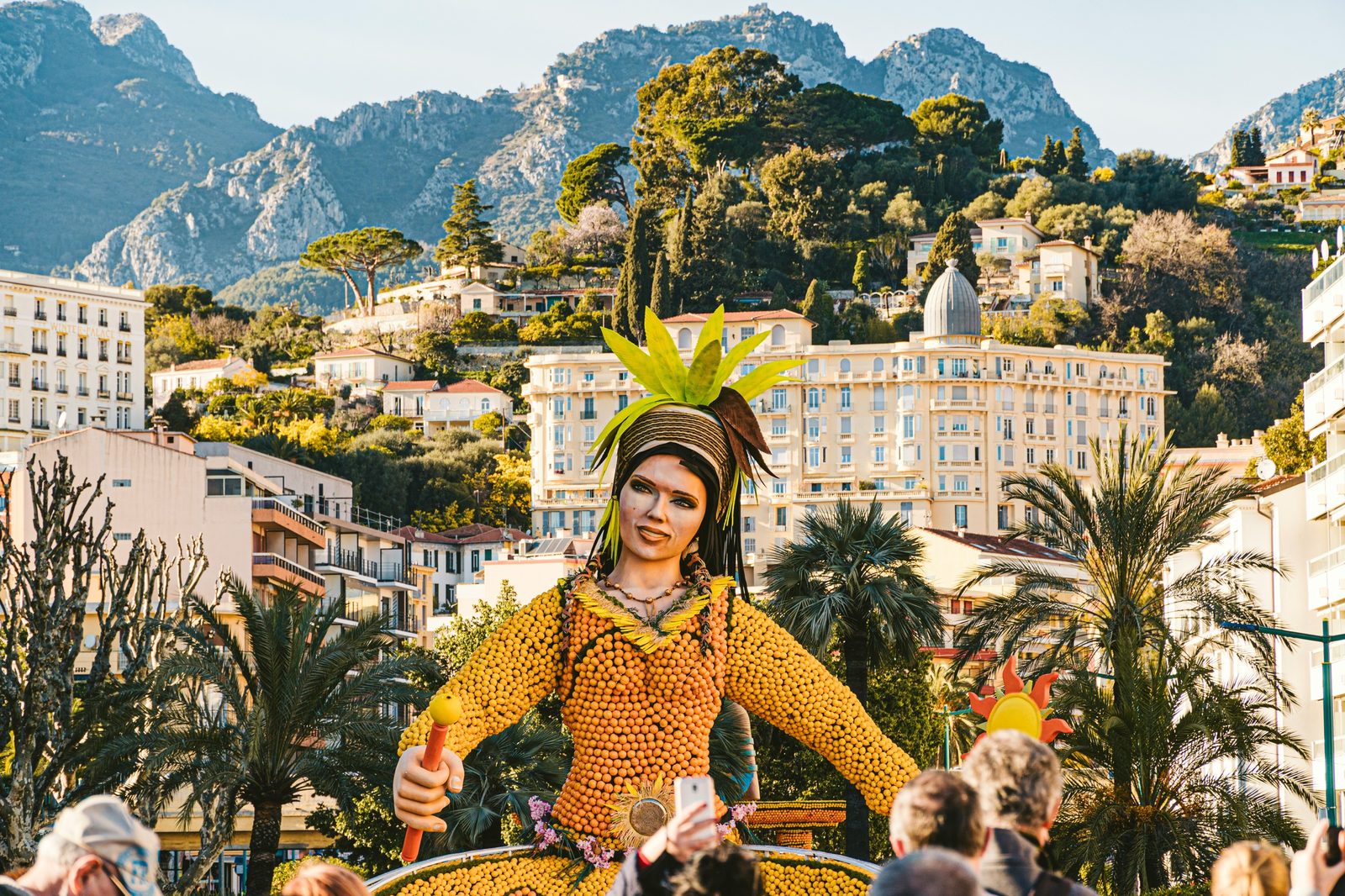Giant citrus sculpture at the Lemon Festival in front of Menton’s façades
