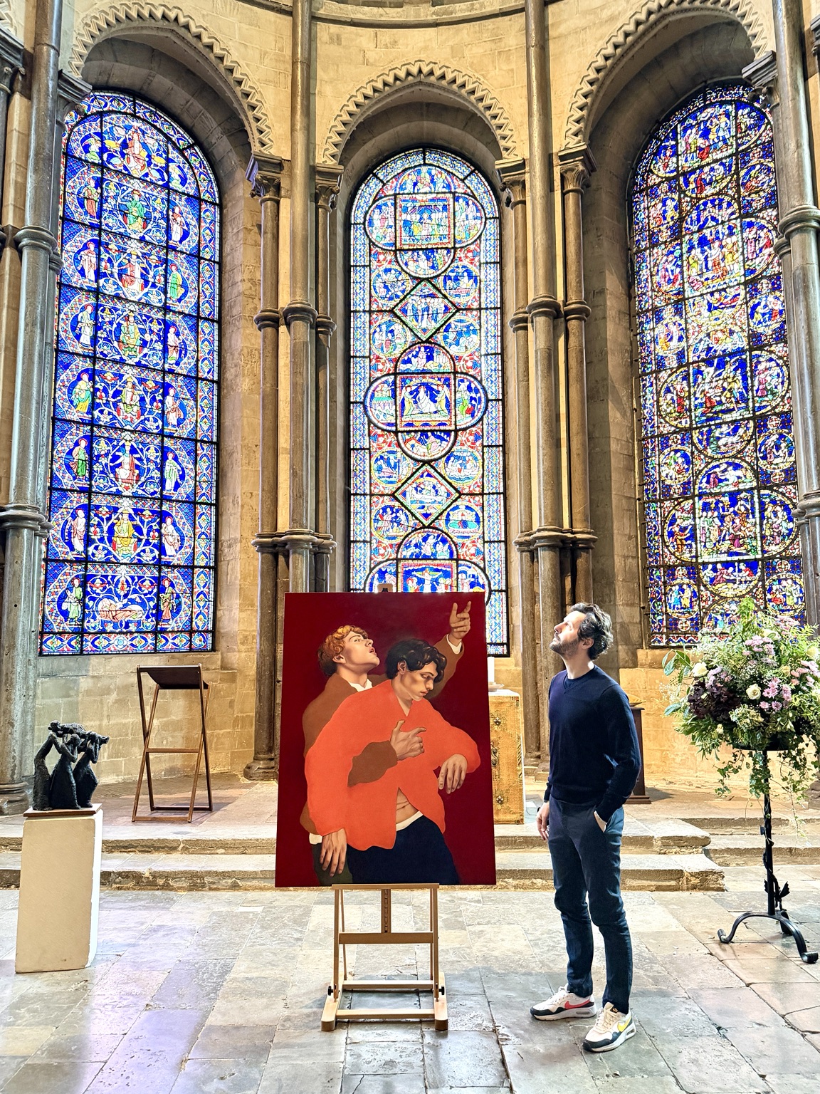 Painter Renaud Muraire with his work on display at Canterbury Cathedral in 2026