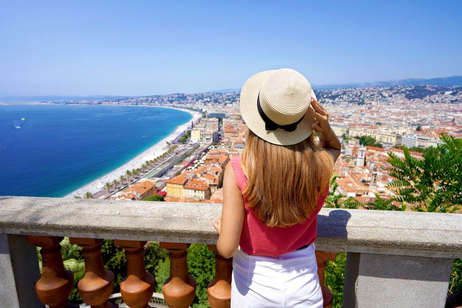 Woman overlooking Nice and the Bay of Angels on the French Riviera